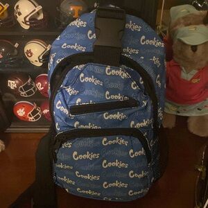 “Cookies” messenger bag. Vinyl front with the bl/wt font. Can fit up to an iPad.